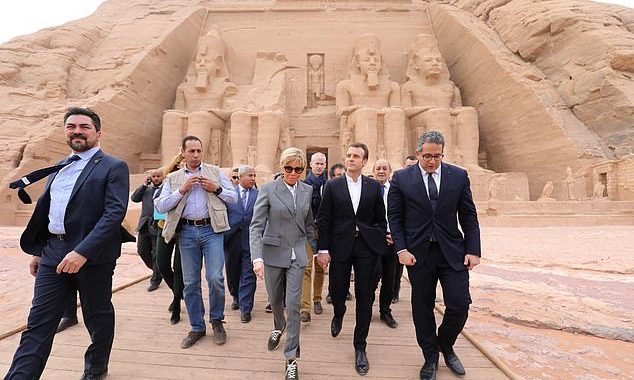 What does she Sphinx she’s wearing? Brigitte Macron, 65, raises eyebrows after teaming a pair of £635 Louis Vuitton trainers with a business suit for a visit to 3,000-year-old temple in Egypt
