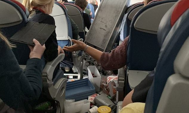 Extreme turbulence hurts five on terrifying Delta flight: Passengers tell how plane nosedived TWICE as drinks carts and bags hurtled around the cabin at 34,000ft before emergency landing in Nevada