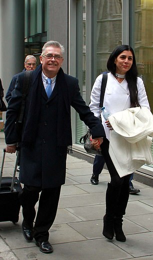 Former BA pilot Chris Burgess, 65, and his wife Cleide, arrive outside the High Court in London