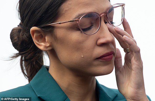 Ocasio-Cortez sheds a tear during a press conference calling on Congress t