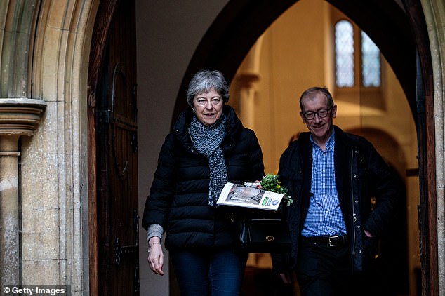 Jeremy Corbyn would be poised on the threshold of Downing Street if Theresa May (pictured today at church in Maidenhead) called a General Election, a Mail on Sunday poll found