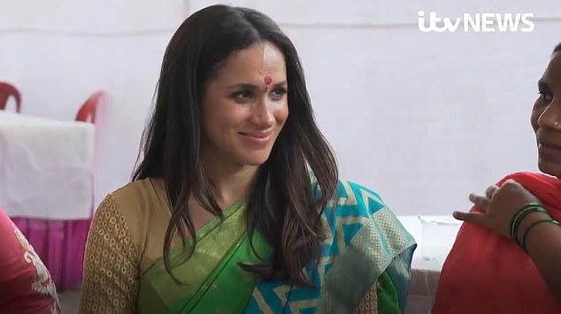 Meghan in a sari: Unseen footage reveals Duchess wearing traditional dress and a bindi during secret trip to Delhi in 2017 – just weeks after news of her relationship with Prince Harry emerged