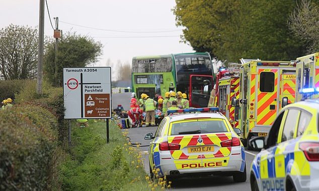 One woman in her sixties dies and 22 people are injured in double-decker bus tragedy: Terrified passengers left trapped as bus collides with two cars on the Isle of Wight