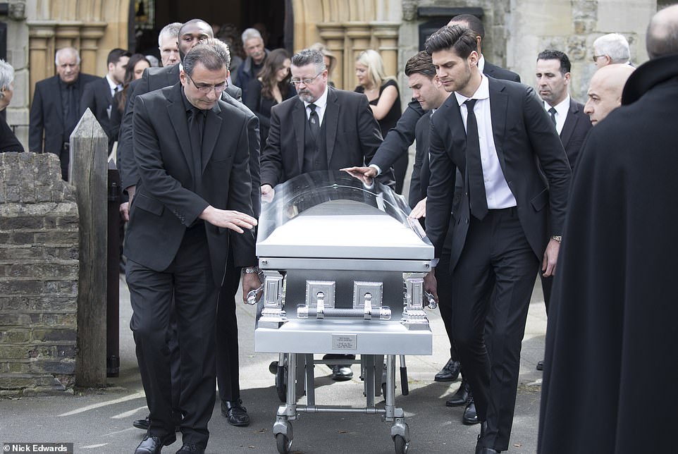 The coffin of Mike Thalassitis is wheeled away from the church following an emotional ceremony at Christ Church in Southgate, north London