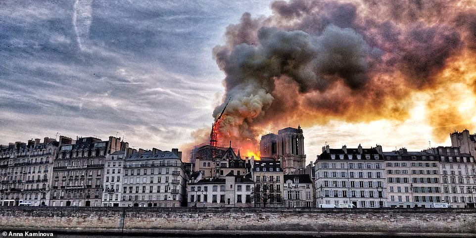 The moment Notre Dame's spire began